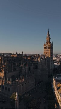 Aerial panorama of historic cathedral at sunset capturing architectural splendor