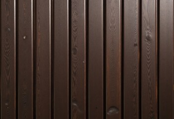 Fototapeta premium Dark brown wooden fence with vertical planks