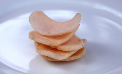 shrimp crackers Indonesian food on white plate