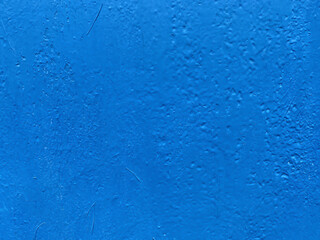 Textured monochrome saturated surface. Old texture with blue paint. Painted background