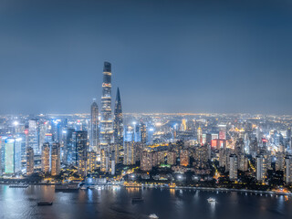 Night view of Shanghai city skyline and Huangpu river, China.
