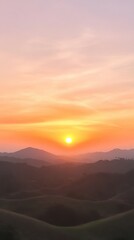 Obraz premium Majestic Sunset Over Simi Hills With Vibrant Orange and Pink Sky and Silhouetted Mountains in Tranquil Scene