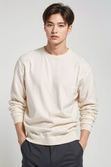 Fototapeta premium A young man in a white shirt stands in front of a white background