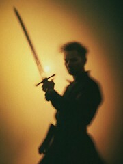 A man holding a sword in his hand. 