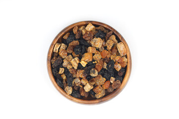 Mix of nuts and dried fruits in wooden bowl isolated on a white background.
