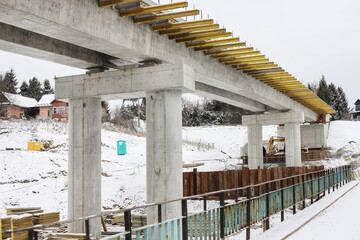 RABKA-ZDROJ, POLAND - JANUARY 05, 2024: Building a large bridge over a small river.