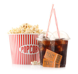 Tasty popcorn, drinks and movie tickets isolated on white