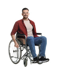 Smiling man in wheelchair on white background