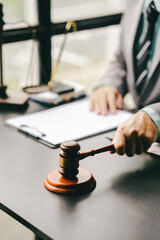 Close-up focuses on judge's hammer on lawyer's table Male consultant or lawyer working in the office Legal concepts, advice