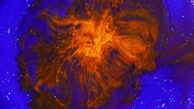 Abstract blue liquid fuses with orange network, sweeping the mixture out of the fusion area creating a magical effect.