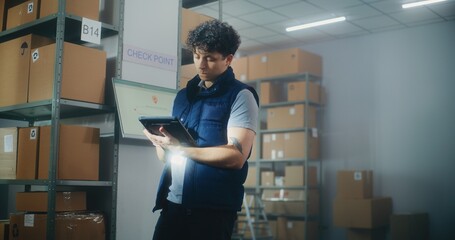 Inventory specialist gives instructions to colleagues, uses tablet computer. Diverse warehouse employees working in sorting center with cardboard boxes, E-commerce online orders, goods for shipping.