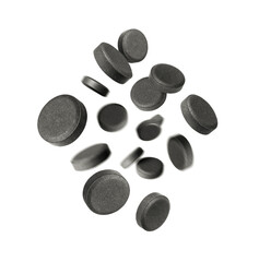 Flying activated carbon pills in the air on white background