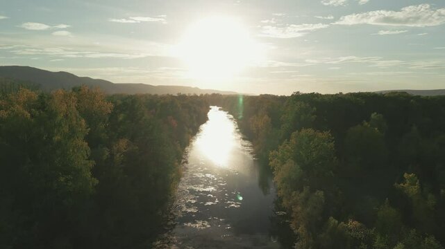 Volga river reflecting sunlight at sunset