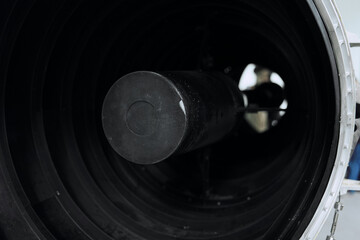 exploring the hidden depths inside view of a large metal tube with mysterious black object