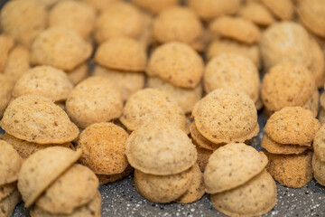 Empty nut shells dough baked cookies on top.
