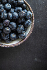 blueberry ripe juicy berries vitamins natural product snack fresh tasty food dish gourmet food background on the table rustic food top view copy space keto and paleo diet Vegetarian and vegan food
