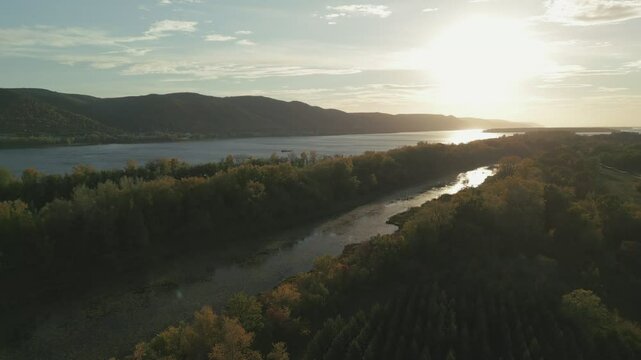 Sunlight reflecting on river between islands at sunset