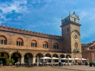 Fototapeta premium Mantova city square with historic architecture, clock tower and outdoor cafes