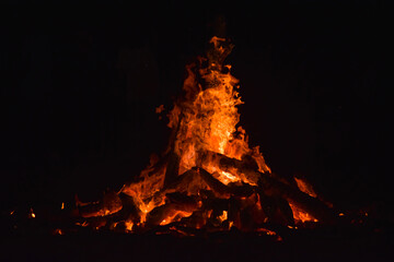 Fiery Campfire Blaze with Glowing Flames and Dark Night Sky