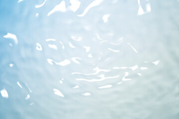 Serene Water Surface with Gentle Ripples and Soft Light Reflection