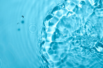 Gentle Water Surface with Vibrant Ripples and Soothing Blue Tones