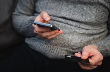 man use smartphone and credit card