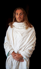 Holy man in a white robe with long hair and beard like Christ