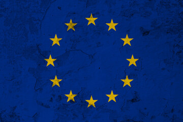 EU flag painted on old concrete wall, abstract Europe politics concept.