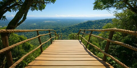 Obraz premium A wooden lookout platform overlooking a lush green valley surrounded by dense trees and a clear blue sky. Concept Wooden Lookout Platform, Lush Green Valley, Dense Trees, Clear Blue Sky
