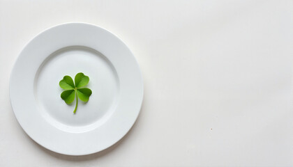 Clover leaf on a white plate, St. Patrick's Day theme