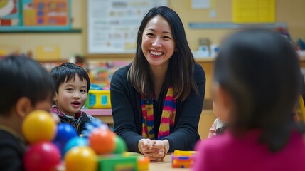 Teacher Smiles With Preschool Children Playing