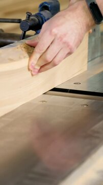 Hand Sanding of a Wooden Part in a Carpentry Workshop