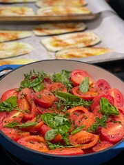 Vibrant Garden Fresh Heirloom Tomatoes Being Cooked into a Homemade Stovetop Tomato Sauce for a Summer Dinner.