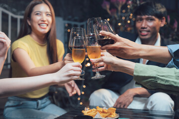 Cheers to Friendship: A group of friends raise their glasses in a toast, celebrating life's simple joys. The warm glow of the setting sun casts a golden hue over the scene.
