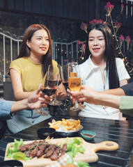 Cheers to Friendship: A group of friends raise their glasses in a warm and celebratory toast, their laughter and joy radiating through the image. It's a moment of connection, shared experiences.