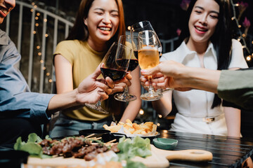 Cheers to Friendship: A group of friends raise their glasses in a toast, their laughter and joy filling the air as they celebrate together.  