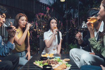 Nightlife Karaoke Fun: Friends enjoying a lively night out with karaoke, drinks, and delicious food.  A vibrant scene of laughter and camaraderie. 