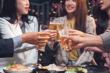 Cheers to Connection:  Friends clinking glasses of beer, celebrating life's simple joys, and creating lasting memories around a table filled with delicious food.  
