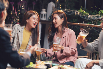 Night Out with Friends: A group of friends enjoy a lively evening, sharing laughter and conversation over drinks in a cozy outdoor setting. This image captures the essence of friendship, camaraderie.