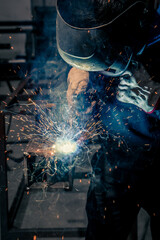 Welder, craftsman, assembly of iron, steel and other metals. Industrial steel welding technician in factory, construction professionals.