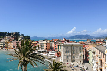 Elevated view of the old fishing village, located on a peninsula  between the Bay of Silence (left) and the Bay of Fairy Tales (in the background), Sestri Levante, Genoa, Liguria, Italy