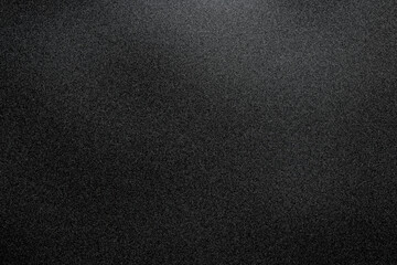 A minimalist dark grainy texture with a subtle gradient, perfect for moody, modern, or abstract design projects.