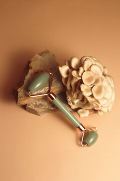 composition with a face roller made of green jade