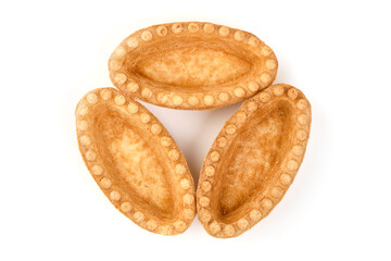 Empty tartlet shells, isolated on white background.