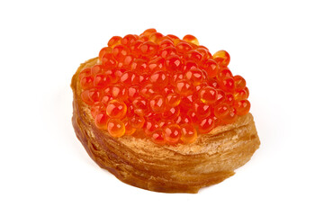 Red caviar on a crispy bread slice, isolated on white background.