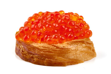 Red caviar on a crispy bread slice, isolated on white background.