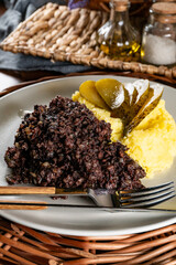 Fried black pudding with mashed potatoes.