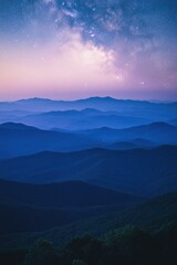 Fototapeta premium panoramic view of mountains bathed in soft hues of twilight with starry sky beginning to emerge