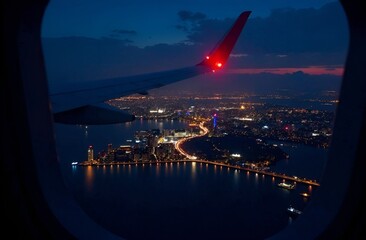 beautiful view from the airplane window over the night city, all in lights.
