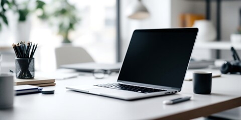 Modern workspace with laptop on desk. Bright home office setup with computer, stationery, and coffee cup. Clean and minimalist design for remote work, freelancing, or studying